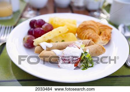 Fruit Crepe And Croissant On A White Plate; Puerto Vallarta Mexico View Large Photo Image Picture - Fruit Crepe And Croissant On A White Plate; Puerto Vallarta Mexico. Fotosearch