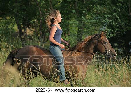 Stock Photo - Girl Riding A Horse Bareback; Troutdale Oregon United States Of America. Fotosearch