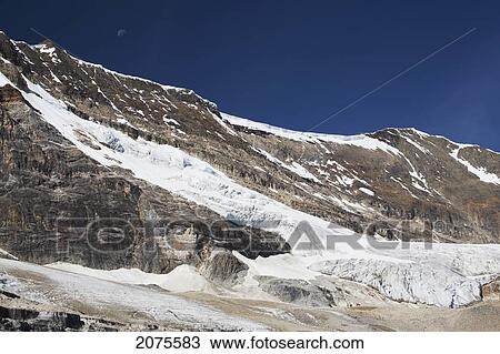 Stock Image - Glacier On Mountain Side With Blue Sky; Field British Columbia Canada. Fotosearch