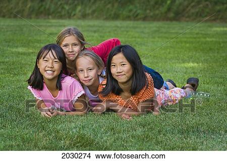 Group Of Girls On A Lawn; Edmonton Alberta Canada View Large Photo Image Picture - Group Of Girls On A Lawn; Edmonton Alberta Canada. Fotosearch