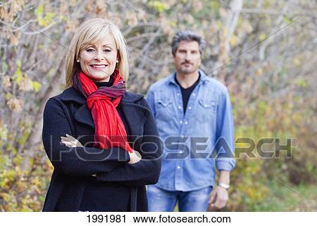 Husband And Wife In A Park In Autumn; St. Albert Alberta Canada View Large Photo Image Stock Image - Husband And Wife In A Park In Autumn; St. Albert Alberta Canada. Fotosearch