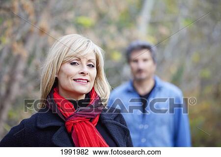 Husband And Wife In A Park In Autumn; St. Albert Alberta Canada View Large Photo Image Stock Image - Husband And Wife In A Park In Autumn; St. Albert Alberta Canada. Fotosearch