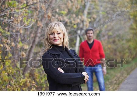 Husband And Wife On A Park Path In Autumn; St. Albert Alberta Canada View Large Photo Image Stock Photo - Husband And Wife On A Park Path In Autumn; St. Albert Alberta Canada. Fotosearch