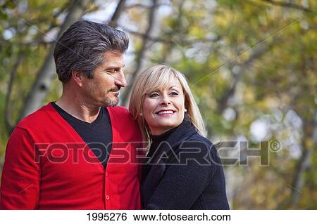 Husband And Wife Together In A Park In Autumn; St. Albert Alberta Canada View Large Photo Image Stock Photograph - Husband And Wife Together In A Park In Autumn; St. Albert Alberta Canada. Fotosearch