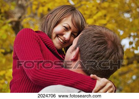 Stock Photograph - Husband And Wife Together In A Park In Autumn; Edmonton Alberta Canada. Fotosearch