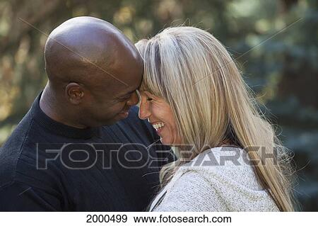 Interracial Couple Laughing - Interracial Mature Cuddling | Niche Top Mature