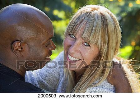 Interracial Married Couple Spending Quality Time Together In A Park; Edmonton Alberta Canada View Large Photo Image Stock Image - Interracial Married Couple Spending Quality Time Together In A Park; Edmonton Alberta Canada. Fotosearch