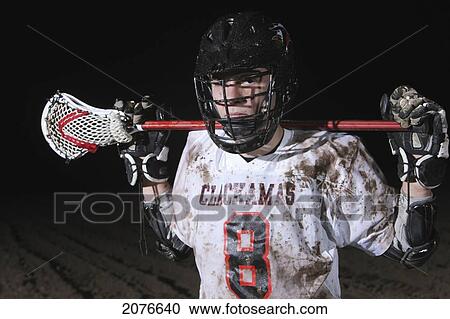 Lacrosse player holding stick behind head; troutdale oregon united states of america View Large Photo Image Stock Image - Lacrosse player holding stick behind head; troutdale oregon united states of america. Fotosearch
