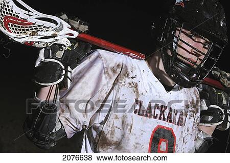 Lacrosse player holding stick behind head; troutdale oregon united states of america View Large Photo Image Stock Photo - Lacrosse player holding stick behind head; troutdale oregon united states of america. Fotosearch
