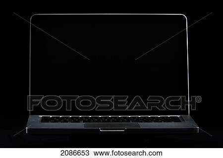 Stock Image - Laptop computer with a dark screen; tarifa cadiz andalusia spain. Fotosearch
