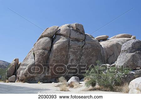 Large Rounded Rock Formation In The Desert With Blue Sky; Palm Springs California United States Of America View Large Photo Image Stock Image - Large Rounded Rock Formation In The Desert With Blue Sky; Palm Springs California United States Of America. Fotosearch
