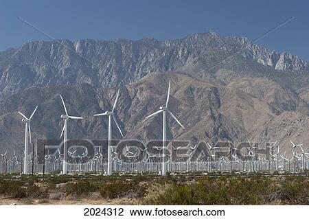 Large Wind Mill Farm With Desert Mountain In The Distance And Blue Sky; Palm Springs California United States Of America View Large Photo Image Stock Image - Large Wind Mill Farm With Desert Mountain In The Distance And Blue Sky; Palm Springs California United States Of America. Fotosearch