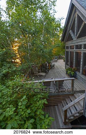 Large wooden deck on the back of a house; lake of the woods ontario canada View Large Photo Image Picture - Large wooden deck on the back of a house; lake of the woods ontario canada. Fotosearch