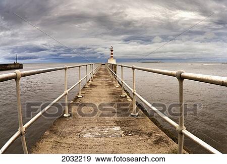 Stock Photo - Lighthouse At The End Of A Pier; Amble Northumberland England. Fotosearch