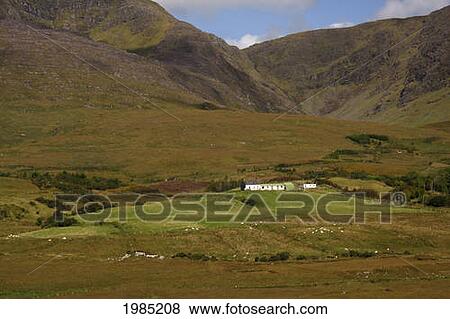 Stock Photo - Lone Farmhouse On The Iveragh Peninsula Or Ring Of Kerry; County Kerry Ireland. Fotosearch