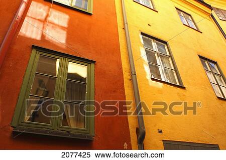 Low angle view of red and yellow painted buildings; stockholm sweden View Large Photo Image Stock Photography - Low angle view of red and yellow painted buildings; stockholm sweden. Fotosearch