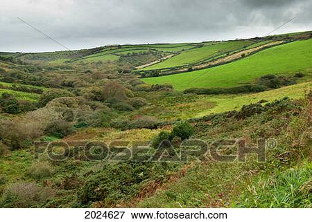 Stock Photo - Lush Green Fields On A Landscape Of Rolling Hills; Ireland. Fotosearch