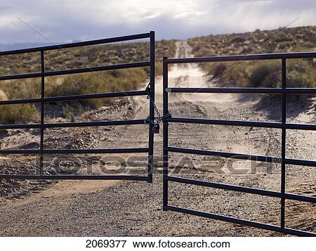 Metal Gate Locked On A Dirt Road In Glen Canyon National Recreation Area; Utah United States Of America View Large Photo Image Stock Photo - Metal Gate Locked On A Dirt Road In Glen Canyon National Recreation Area; Utah United States Of America. Fotosearch