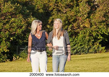 Mother And Daughter Spending Time Together In A Park; Edmonton Alberta Canada View Large Photo Image Stock Image - Mother And Daughter Spending Time Together In A Park; Edmonton Alberta Canada. Fotosearch
