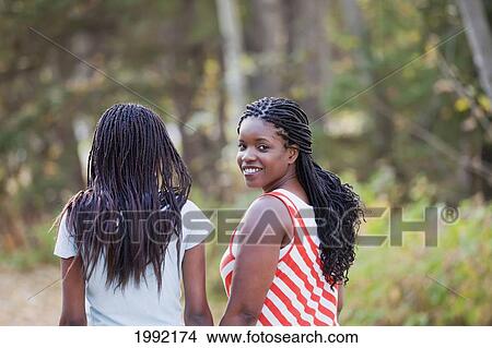 Picture - Mother And Daughter Walking In A Park; Edmonton Alberta Canada. Fotosearch
