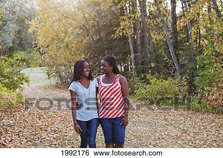 Mother And Daughter Walking In A Park; Edmonton Alberta Canada View Large Photo Image Stock Photograph - Mother And Daughter Walking In A Park; Edmonton Alberta Canada. Fotosearch
