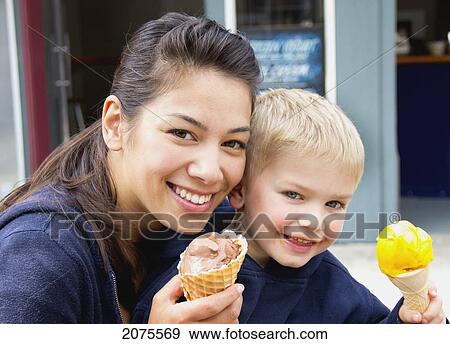 Mother And Son Eating Ice Cream; Richmond British Columbia Canada View Large Photo Image Stock Photo - Mother And Son Eating Ice Cream; Richmond British Columbia Canada. Fotosearch