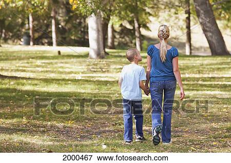Stock Photo - Mother And Son Spending Quality Time Together In A Park In Autumn; Edmonton Alberta Canada. Fotosearch