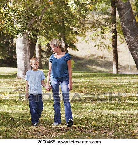 Stock Photo - Mother And Son Spending Quality Time Together In A Park In Autumn; Edmonton Alberta Canada. Fotosearch