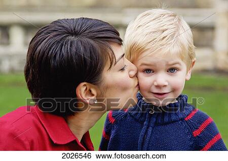 Mother Kissing Her Young Son; Cambridge England View Large Photo Image Stock Photograph - Mother Kissing Her Young Son; Cambridge England. Fotosearch