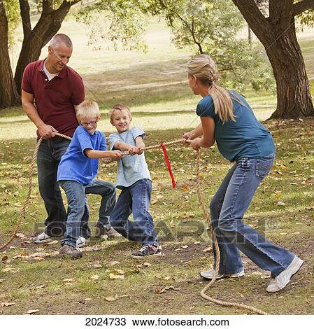 Mother Playing Tug Of War Against Husband And Sons; Edmonton Alberta Canada View Large Photo Image Stock Image - Mother Playing Tug Of War Against Husband And Sons; Edmonton Alberta Canada. Fotosearch