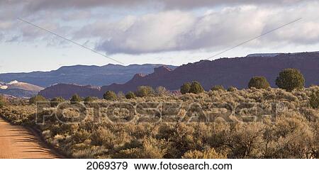 Mountains And Desert Plants On A Landscape In Kane County; Pahreah Utah United States Of America View Large Photo Image Stock Photo - Mountains And Desert Plants On A Landscape In Kane County; Pahreah Utah United States Of America. Fotosearch
