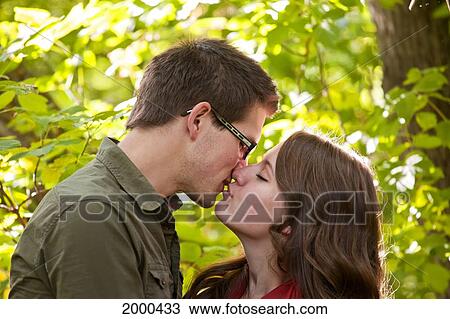 Newlywed Couple Kissing In The Park; Edmonton Alberta Canada View Large Photo Image Stock Image - Newlywed Couple Kissing In The Park; Edmonton Alberta Canada. Fotosearch