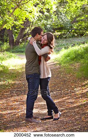 Newlywed Couple Spending Time Together In A Park In Autumn; Edmonton Alberta Canada View Large Photo Image Stock Image - Newlywed Couple Spending Time Together In A Park In Autumn; Edmonton Alberta Canada. Fotosearch