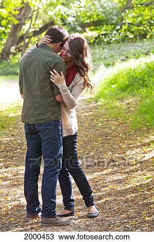 Stock Image - Newlywed Couple Spending Time Together In A Park In Autumn; Edmonton Alberta Canada. Fotosearch