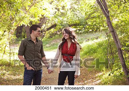 Newlywed Couple Walking In A Park In Autumn; Edmonton Alberta Canada View Large Photo Image Stock Image - Newlywed Couple Walking In A Park In Autumn; Edmonton Alberta Canada. Fotosearch