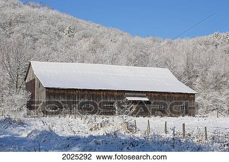 Stock Image - Old Barn In Winter; Iron Hill Quebec Canada. Fotosearch