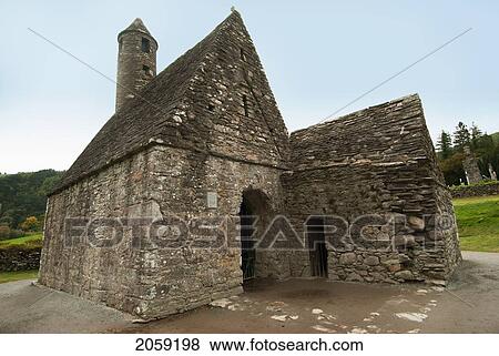 Stock Photo - Old Building And Roundtower; Ireland. Fotosearch
