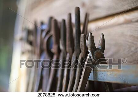 Old rusted tools on a wooden shelf; saanichton british columbia canada View Large Photo Image Stock Photo - Old rusted tools on a wooden shelf; saanichton british columbia canada. Fotosearch