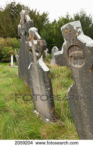 Old Weathered Tombstones; Ireland View Large Photo Image Picture - Old Weathered Tombstones; Ireland. Fotosearch