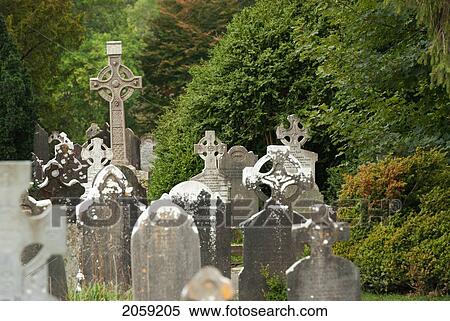 Stock Photography - Old Weathered Tombstones; Ireland. Fotosearch