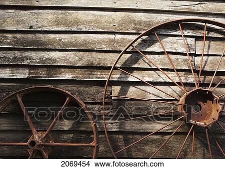 Old Wheels Against A Wooden Wall; Margaret River West Australia Australia View Large Photo Image Picture - Old Wheels Against A Wooden Wall; Margaret River West Australia Australia. Fotosearch
