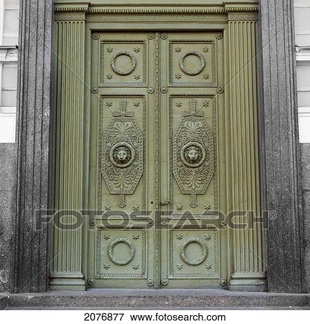 Stock Photo - Ornate design on green doors; st. petersburg russia. Fotosearch
