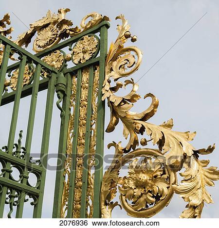 Stock Photograph - Ornate gold design on a metal railing at drottningholm palace; stockholm sweden. Fotosearch