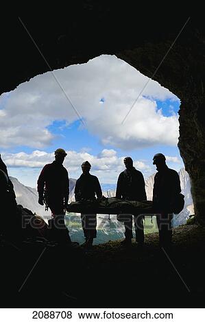 Participant's silhouettes at a gargantua cave rescue; blairmore alberta canada View Large Photo Image Stock Photo - Participant's silhouettes at a gargantua cave rescue; blairmore alberta canada. Fotosearch
