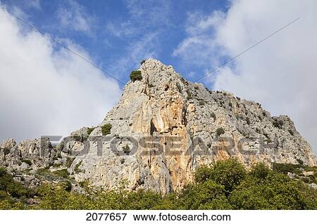 Peak of a rugged rock formation near pantano del chorro; andalusia spain View Large Photo Image Stock Photo - Peak of a rugged rock formation near pantano del chorro; andalusia spain. Fotosearch