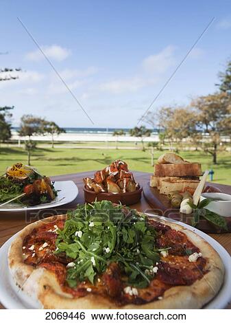 Pizza And Spanish Tapas; Kirra Gold Coast Queensland Australia View Large Photo Image Stock Photograph - Pizza And Spanish Tapas; Kirra Gold Coast Queensland Australia. Fotosearch