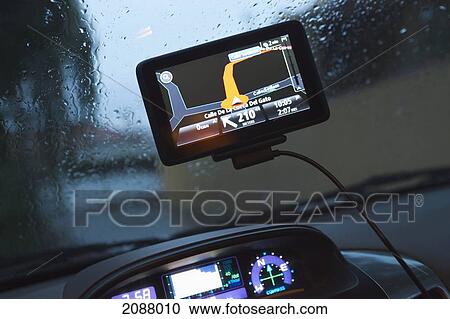Stock Image - Portable gps satellite navigation system mounted in a car; torremolinos malaga province spain. Fotosearch