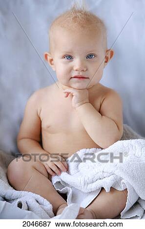 Stock Photo - Portrait Of A Baby Holding Hand Under Chin; Portland Oregon United States Of America. Fotosearch