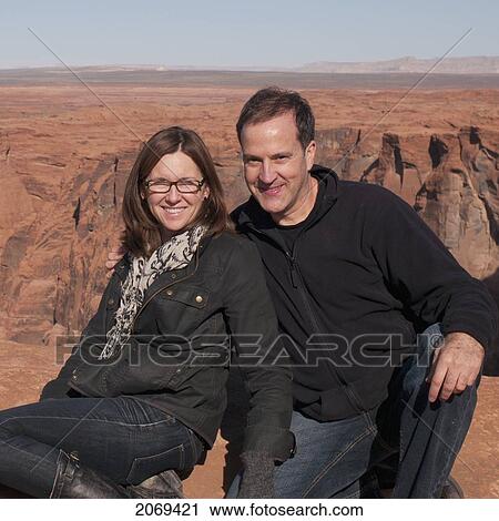 Portrait Of A Couple And A Vast Landscape In The Distance; Arizona United States Of America View Large Photo Image Stock Image - Portrait Of A Couple And A Vast Landscape In The Distance; Arizona United States Of America. Fotosearch