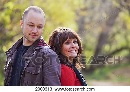 Portrait Of A Couple In A Park In Autumn; Edmonton Alberta Canada View Large Photo Image Stock Image - Portrait Of A Couple In A Park In Autumn; Edmonton Alberta Canada. Fotosearch